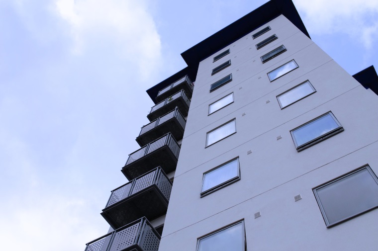 Tall building behind court yard garden