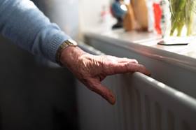 Customer with their hand on the radiator