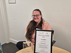 Photo of community award winner Lucy Jones with her certificate