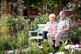 Two people sitting on a bench