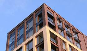 Tall building with blue sky in background 