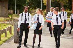 school children walking on path